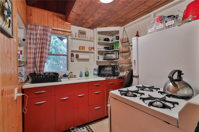 23679 Hillside Dr, Crestline, CA 92325 - kitchen with red cabinets, white appliances, yellow cabinets, wood ceiling, and light countertops