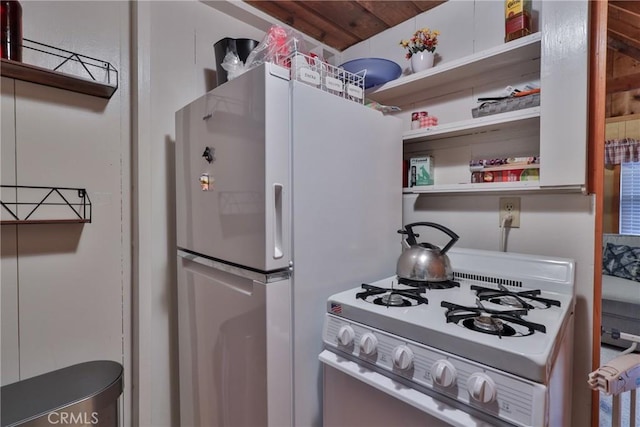 23679 Hillside Dr, Crestline, CA 92325 - kitchen featuring open shelves and white appliances