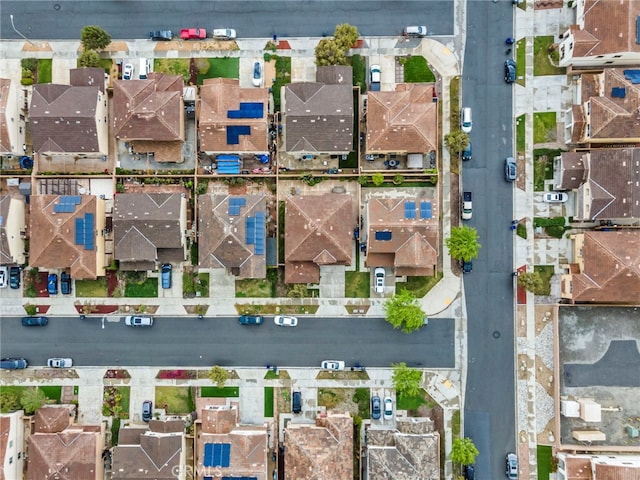 birds eye view of property with a residential view