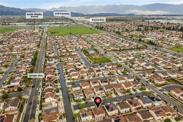 bird's eye view with a residential view and a mountain view