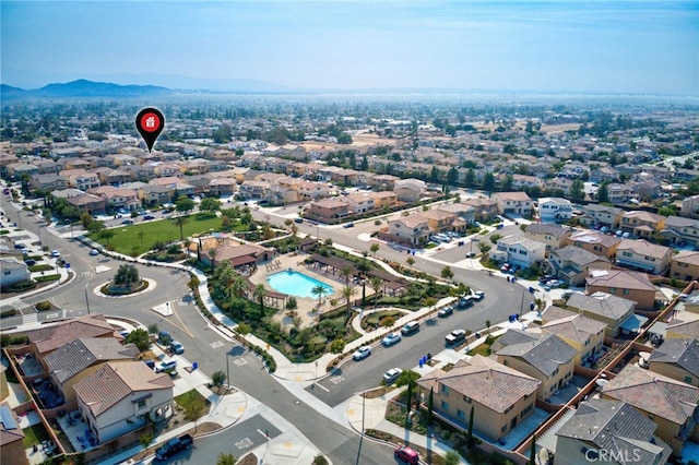drone / aerial view featuring a residential view and a mountain view