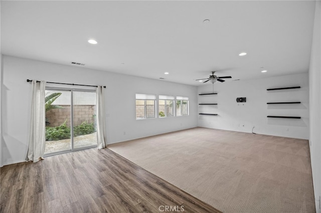 unfurnished living room featuring visible vents, recessed lighting, and a ceiling fan