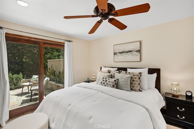 bedroom with a ceiling fan and access to exterior