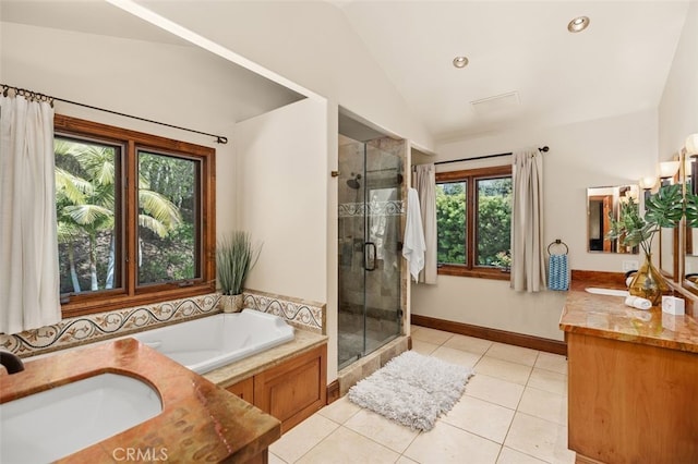 full bath featuring vanity, lofted ceiling, tile patterned flooring, and a stall shower
