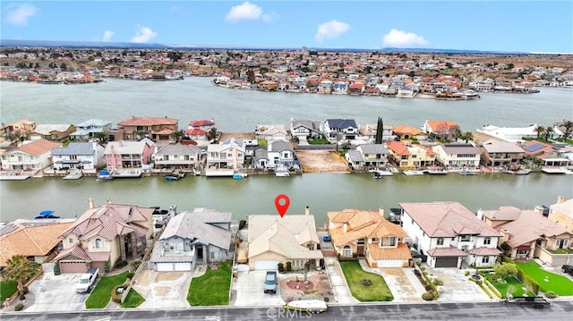 aerial view with a residential view and a water view