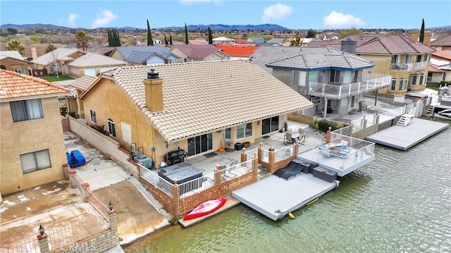 bird's eye view featuring a residential view and a water view