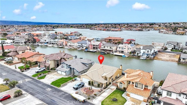 bird's eye view with a residential view and a water view