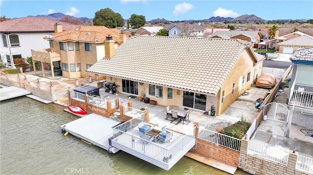 bird's eye view with a residential view and a water and mountain view