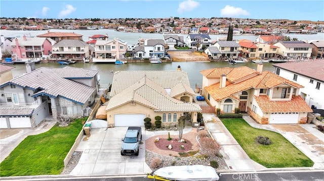 aerial view with a residential view and a water view