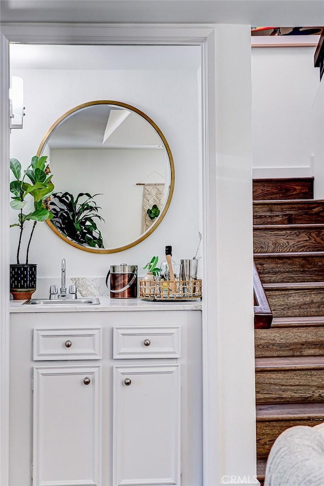 bar with a sink and stairs