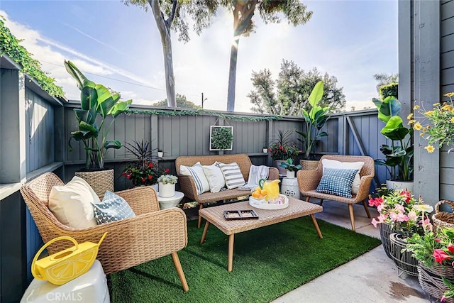 view of patio featuring an outdoor hangout area and a fenced backyard