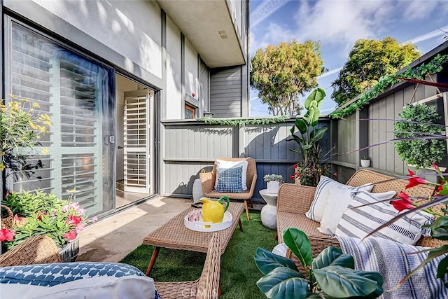 view of patio with an outdoor hangout area and a fenced backyard