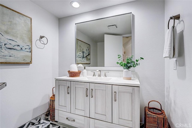 bathroom featuring visible vents and vanity