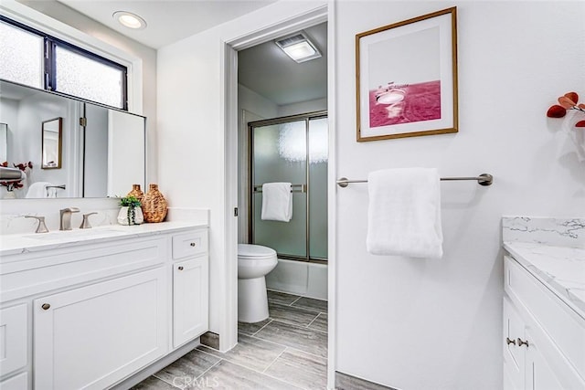 full bathroom featuring toilet and vanity