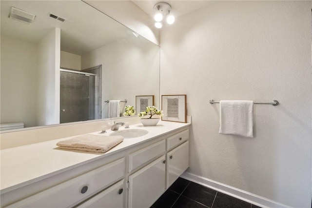 380 W Wilson St Unit A102, Costa Mesa, CA 92627 - full bathroom featuring vanity, tile patterned flooring, and a shower stall