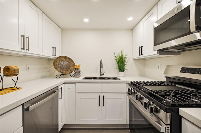 380 W Wilson St Unit A102, Costa Mesa, CA 92627 - kitchen featuring appliances with stainless steel finishes, white cabinetry, light countertops, and recessed lighting