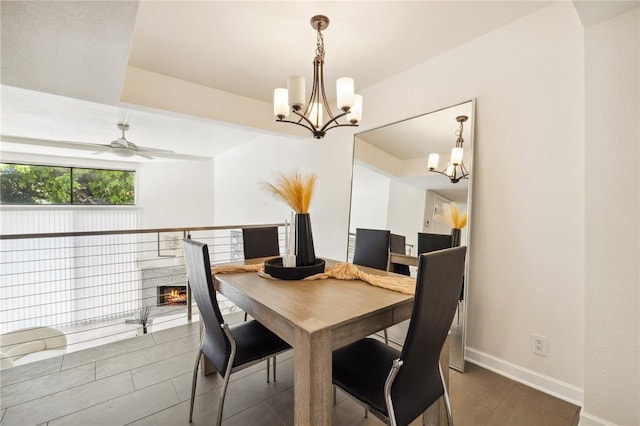 380 W Wilson St Unit A102, Costa Mesa, CA 92627 - tiled dining area featuring a chandelier and a ceiling fan
