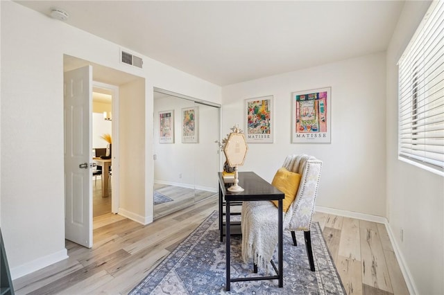 380 W Wilson St Unit A102, Costa Mesa, CA 92627 - dining area with light wood-style floors and baseboards