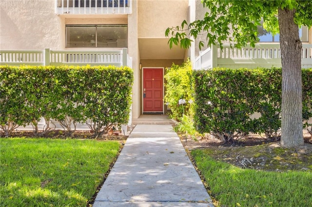 380 W Wilson St Unit A102, Costa Mesa, CA 92627 - property entrance featuring stucco siding