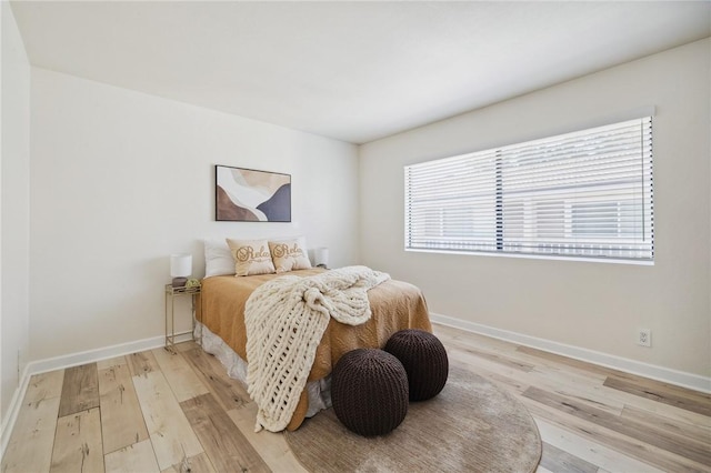 380 W Wilson St Unit A102, Costa Mesa, CA 92627 - bedroom featuring wood finished floors and multiple windows