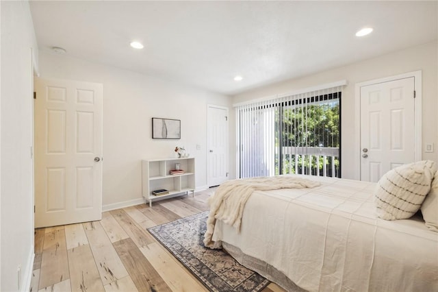 380 W Wilson St Unit A102, Costa Mesa, CA 92627 - bedroom with wood finished floors, recessed lighting, and access to outside