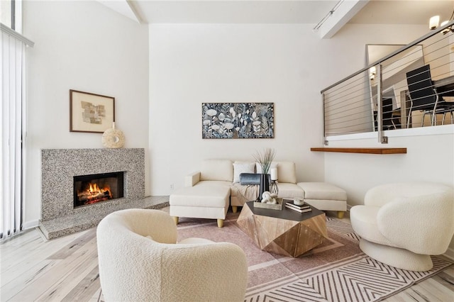 380 W Wilson St Unit A102, Costa Mesa, CA 92627 - living area with wood finished floors and a premium fireplace
