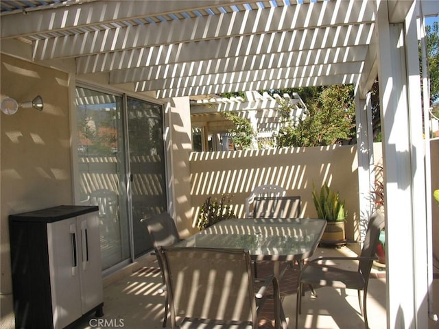 view of patio / terrace featuring a pergola and outdoor dining area