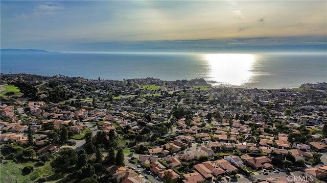 drone / aerial view featuring a residential view and a water view