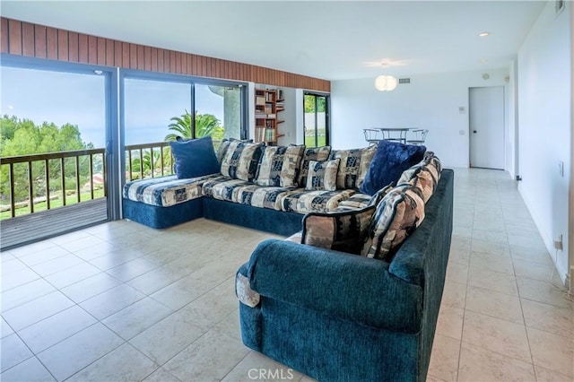 living room featuring light tile patterned floors and visible vents