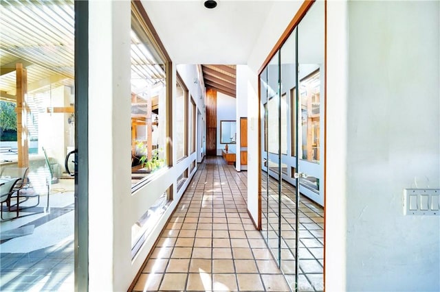 hall with light tile patterned flooring