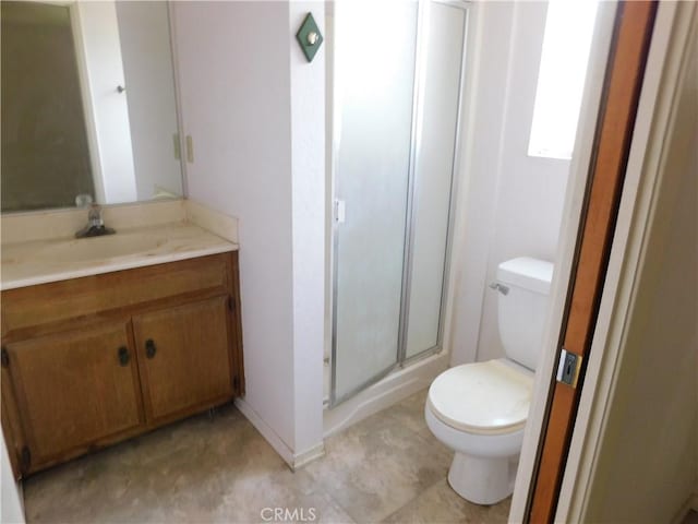 full bath featuring a stall shower, toilet, and vanity