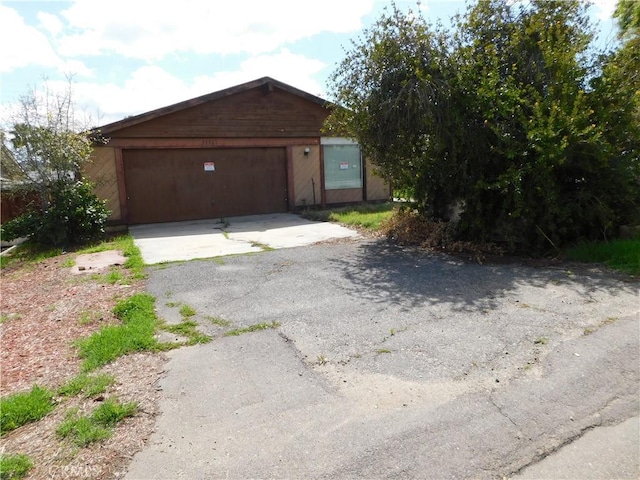 garage with aphalt driveway