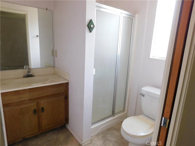 full bath with vanity, toilet, and a shower stall