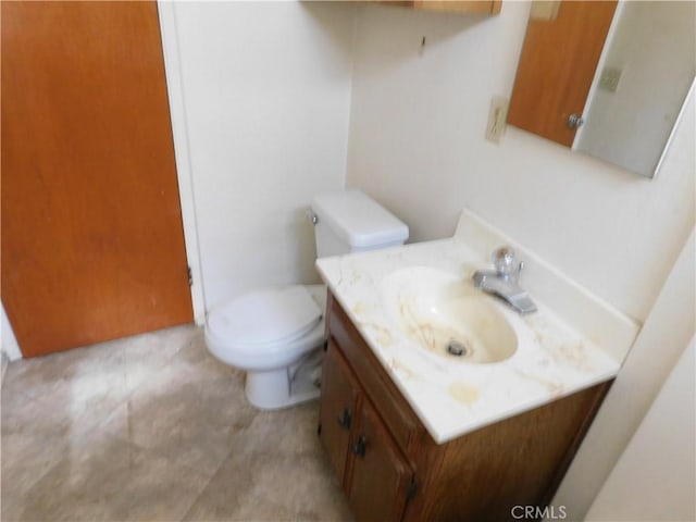 half bath with toilet and vanity