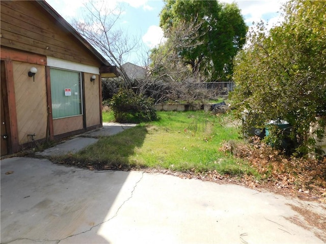 view of yard featuring a patio and fence