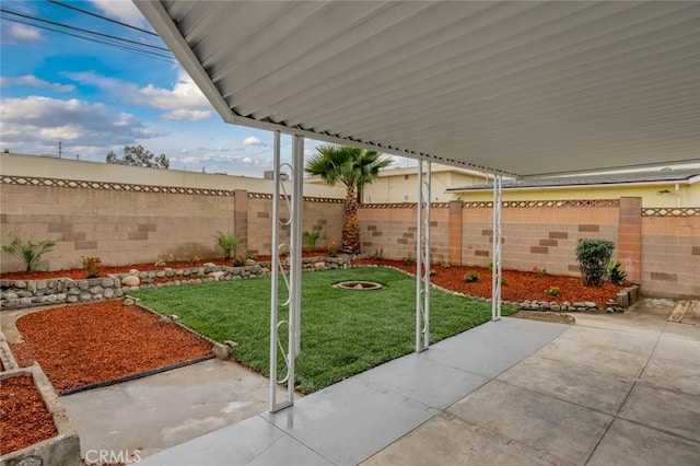 view of yard featuring a patio area and a fenced backyard