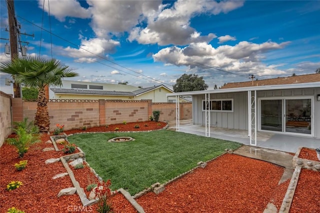 view of yard with a patio area and a fenced backyard