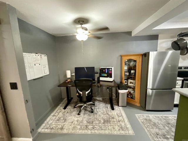 office space featuring finished concrete floors and a ceiling fan