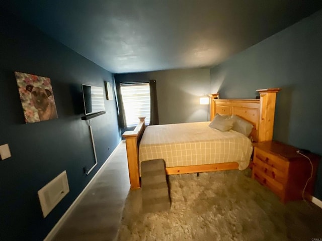 bedroom featuring visible vents and baseboards