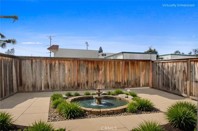 view of patio with a fenced backyard