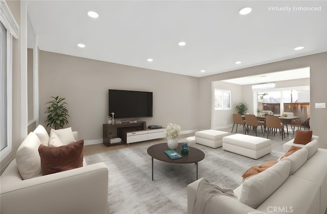 living room featuring recessed lighting and baseboards