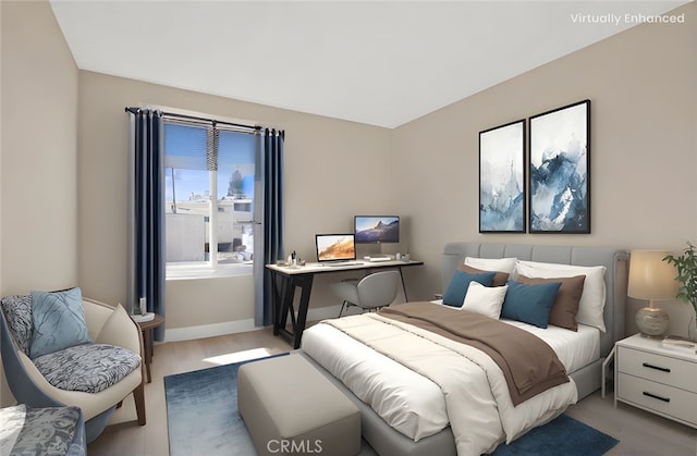 bedroom featuring baseboards and light wood-type flooring