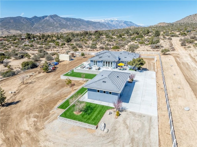 aerial view with a mountain view and view of desert