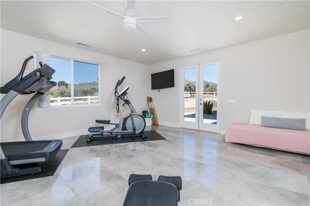 workout area featuring a wealth of natural light, visible vents, french doors, and a ceiling fan