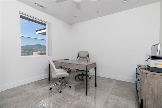 office area with visible vents, ceiling fan, and baseboards