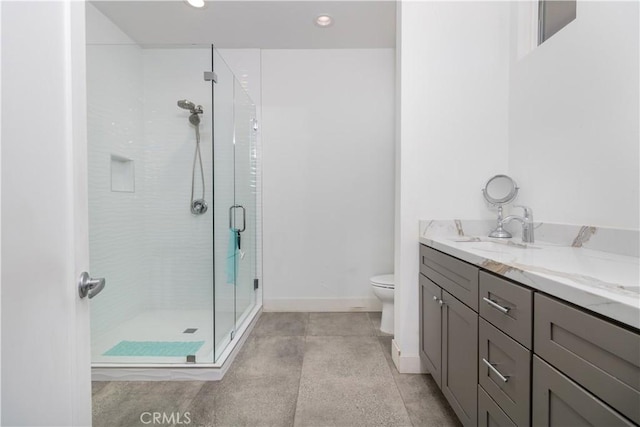 bathroom featuring a shower stall, baseboards, toilet, recessed lighting, and vanity