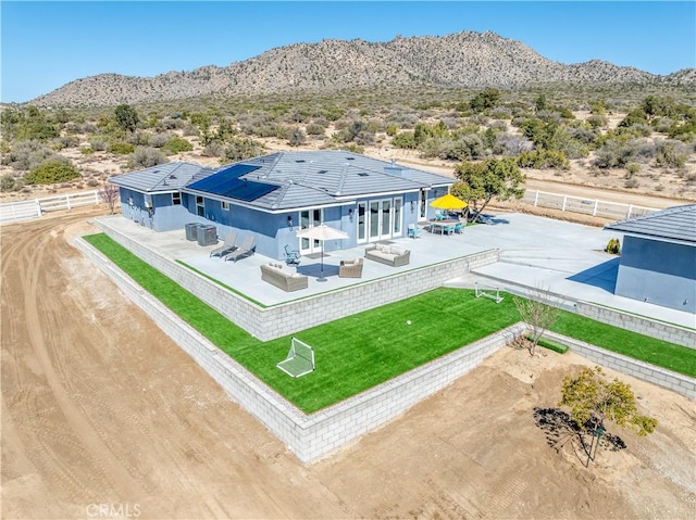 birds eye view of property featuring a mountain view