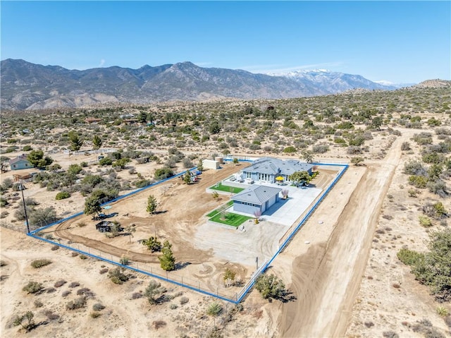 drone / aerial view with a mountain view and a desert view