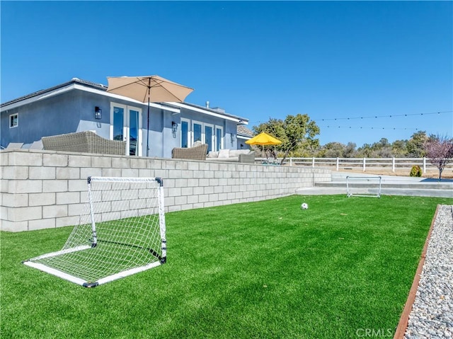 view of yard with fence