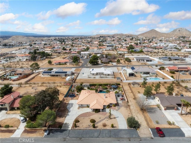 birds eye view of property with a residential view and a mountain view